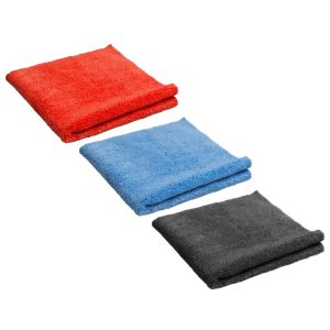 Three microfiber towels folded into square shapes. One is red, one light blue and the other black.