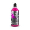 Transparent bottle containing pink coloured liquid called Alexandrite Organic Acid Shampoo