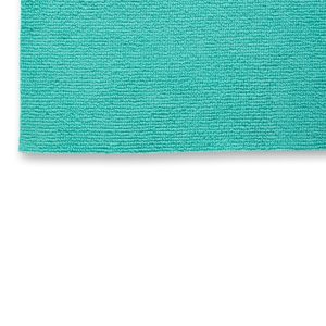 Close up of edge of a light blue green microfiber cloth