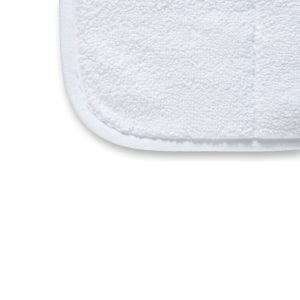 Close up of one corner of white heavyweight microfiber drying towel with edging.