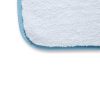 Close up of one corner of white heavyweight microfiber drying towel with light blue edging.