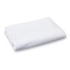 Rectangular folded white waffle-weave towel.