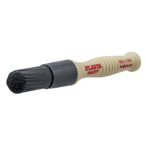 Wheel Brush with black bristles and plastic beige handle with the wording 'ATLASTA' in red letters.