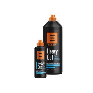 Two black plastic bottles with orange nozzle containing Heavy Cut Cutting Compound