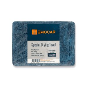 Thick blue drying towel folded and packaged in transparent plastic.