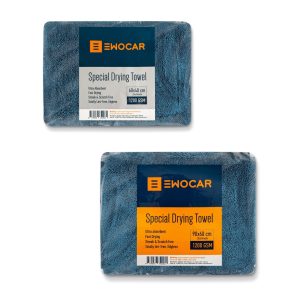 Two thick blue drying towels folded inside individual transparent plastic packages.