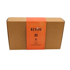 Closed brown rectangular carton box with orange wrap-around paper titled 'Revive Wax Kit'