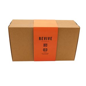 Closed brown rectangular carton box with orange wrap-around paper titled 'Revive 03 - Prepare'