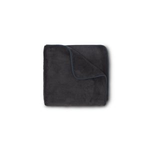 Luxury plush drying towel in dark grey by brand Revive, folded into four.