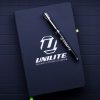 Hardback notepad by Unilite lying flat with pen over it.