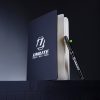 Hardback notepad by Unilite with pen next to it.