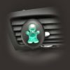 Liquid membrane green doll shaped air freshener stuck to vent of car.