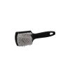 Black plastic brush with white nylon bristles lying on its side