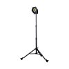 Site light on black tripod stand with wheels.