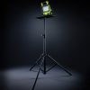 Work light on black tripod with stand.