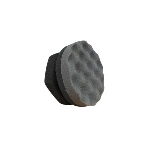 Tyre dressing foam applicator pad with curvy texture for scrubbing and with handle shape.