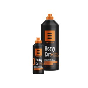 Two black plastic bottles with orange nozzle containing Heavy Cut Plus Cutting Compound