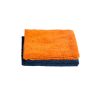 Thick orange microfiber buffing towel sits folded over another one in dark blue colour.