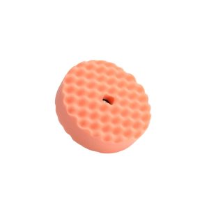 Orange polishing double sided waffle foam pad with a five eighths fitting.