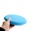 Light blue medium cut flat face foam pad in size 9 inch being held in a hand.