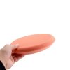 Orange polishing flat face foam pad in size 9 inch held in a hand.